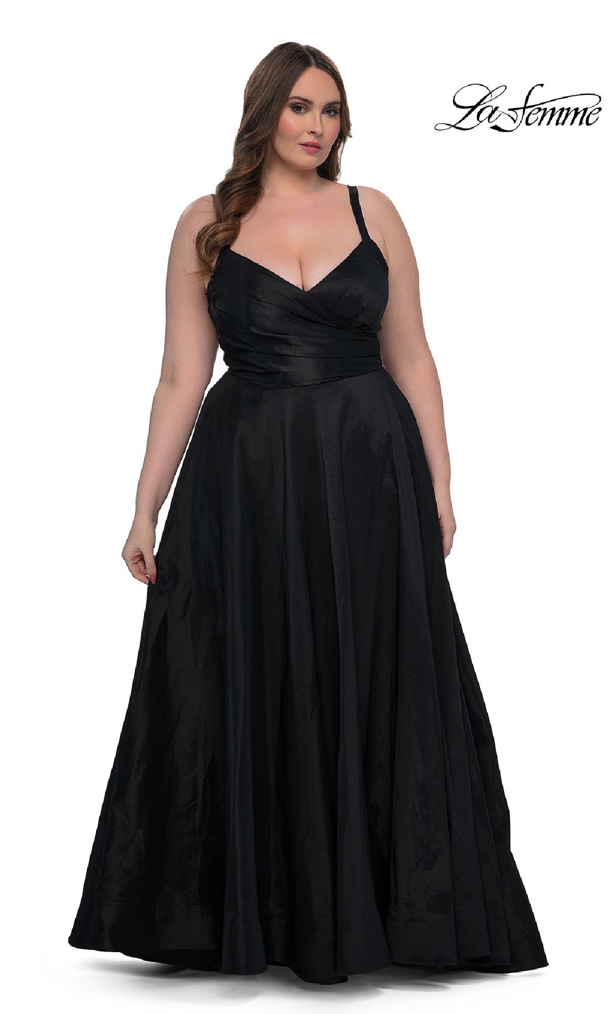 A woman models the Long Plus-Size Prom Dress: La Femme 33075, a sleeveless, floor-length black gown with a fitted bodice and elegant A-line skirt, standing against a white background with the